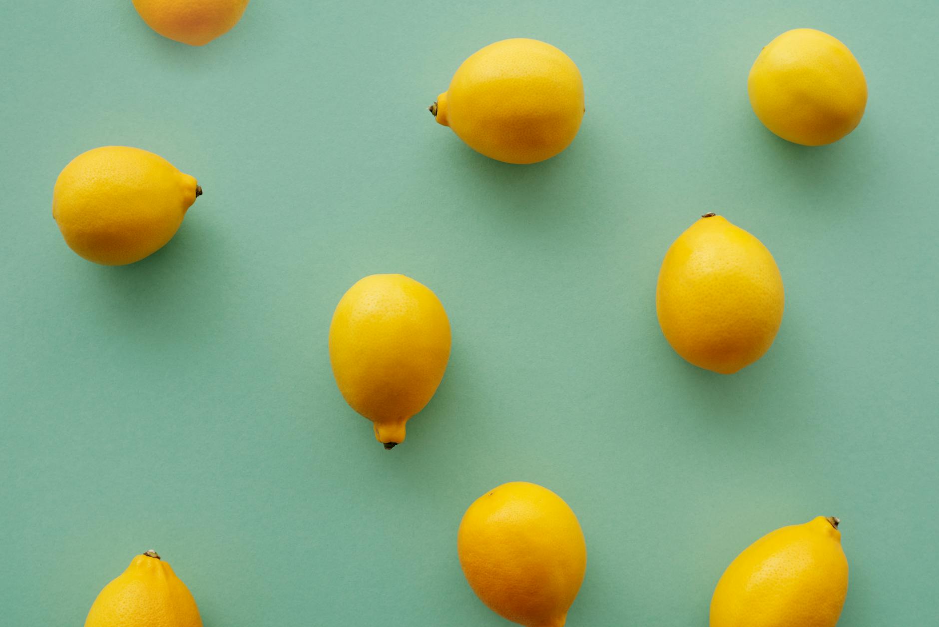 Fresh bright yellow lemons on a vibrant background, symbolizing freshness and vitality at any age